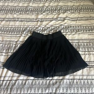 pleated black mini skirt